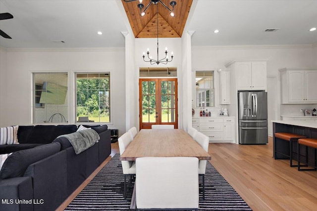 6603 Wirtz Rd, Flowood, MS 39232 - dining space featuring a chandelier, light wood-style flooring, crown molding, french doors, and recessed lighting
