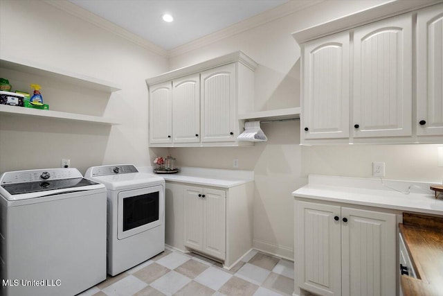 6603 Wirtz Rd, Flowood, MS 39232 - laundry room with washing machine and clothes dryer, ornamental molding, light flooring, cabinet space, and baseboards