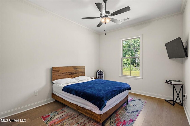 6603 Wirtz Rd, Flowood, MS 39232 - bedroom featuring wood-type flooring, baseboards, ornamental molding, and a ceiling fan