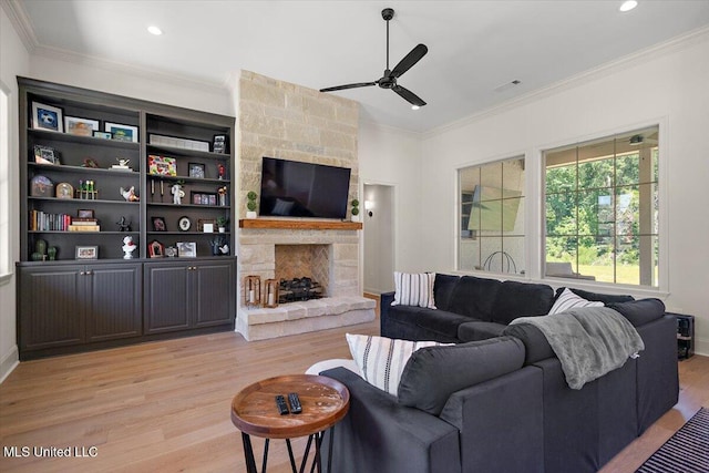 6603 Wirtz Rd, Flowood, MS 39232 - living area with light wood-type flooring, ceiling fan, a stone fireplace, crown molding, and recessed lighting