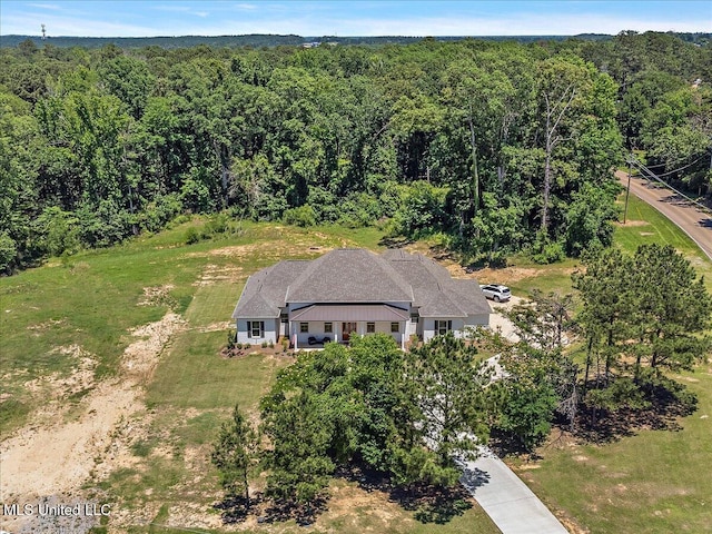 6603 Wirtz Rd, Flowood, MS 39232 - aerial view of property and surrounding area featuring a heavily wooded area
