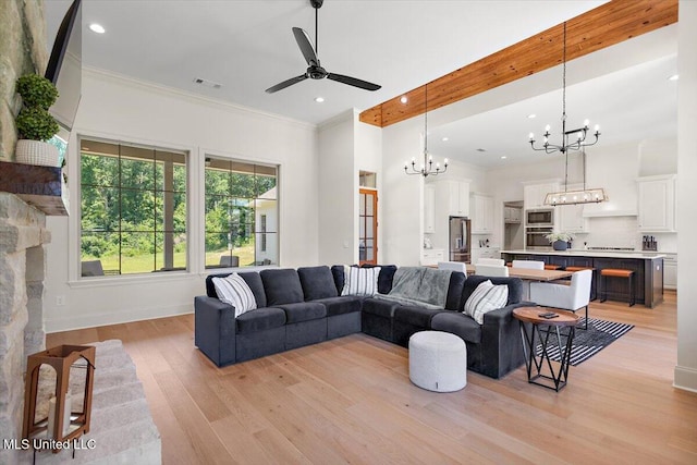 6603 Wirtz Rd, Flowood, MS 39232 - living room with a chandelier, ceiling fan, ornamental molding, light wood-style flooring, and recessed lighting