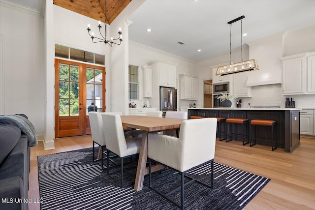 6603 Wirtz Rd, Flowood, MS 39232 - dining space featuring a chandelier, light wood-style flooring, ornamental molding, and recessed lighting