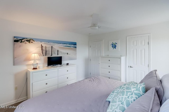 2421 Beachview Dr Unit D07, Ocean Springs, MS 39564 - bedroom featuring baseboards and ceiling fan