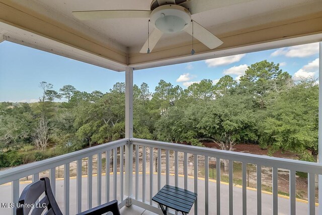 2421 Beachview Dr Unit D07, Ocean Springs, MS 39564 - balcony with a ceiling fan and view of scattered trees