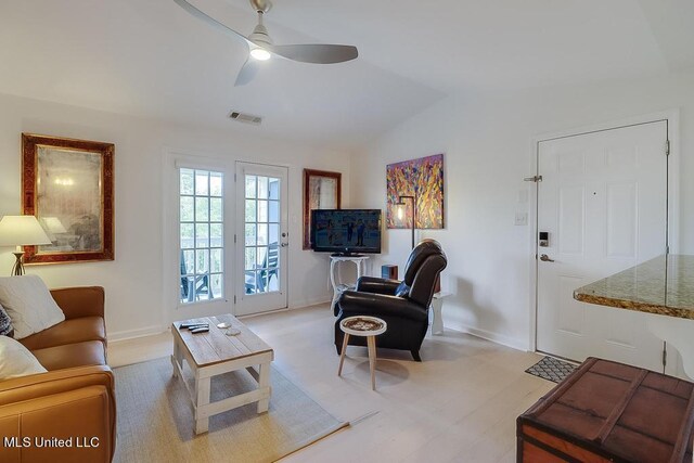 2421 Beachview Dr Unit D07, Ocean Springs, MS 39564 - living room featuring vaulted ceiling, a ceiling fan, and baseboards