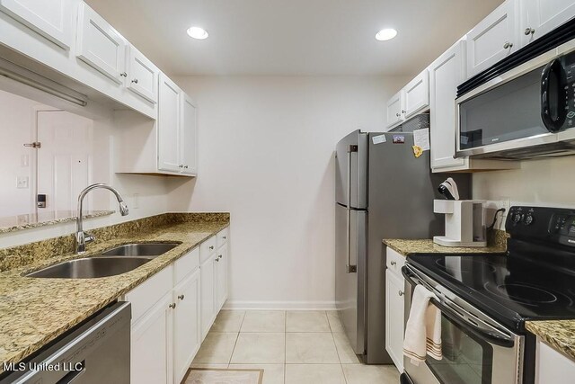 2421 Beachview Dr Unit D07, Ocean Springs, MS 39564 - kitchen with appliances with stainless steel finishes, a sink, white cabinets, light stone countertops, and recessed lighting