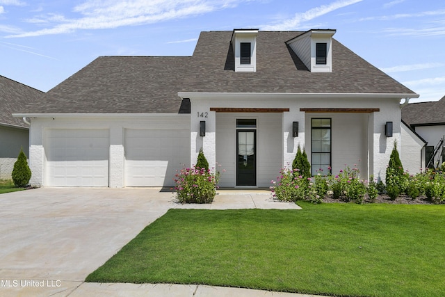 view of front of property featuring an attached garage, roof with shingles, driveway, and a front lawn