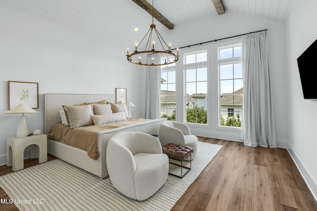 bedroom featuring light wood-type flooring, lofted ceiling with beams, baseboards, and an inviting chandelier