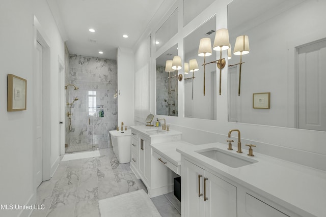 bathroom featuring marble finish floor, a soaking tub, a sink, and a shower stall