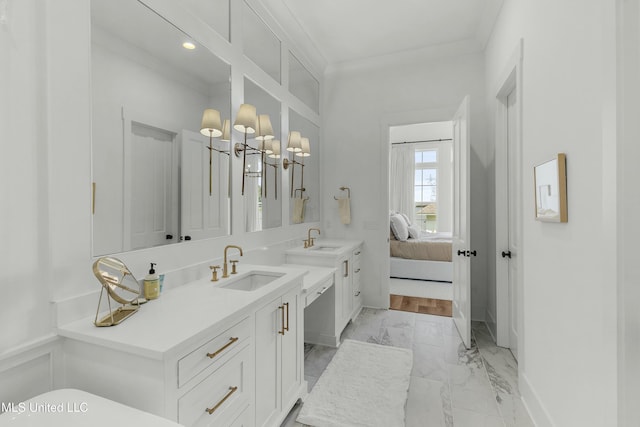 ensuite bathroom featuring marble finish floor, ensuite bath, crown molding, and vanity