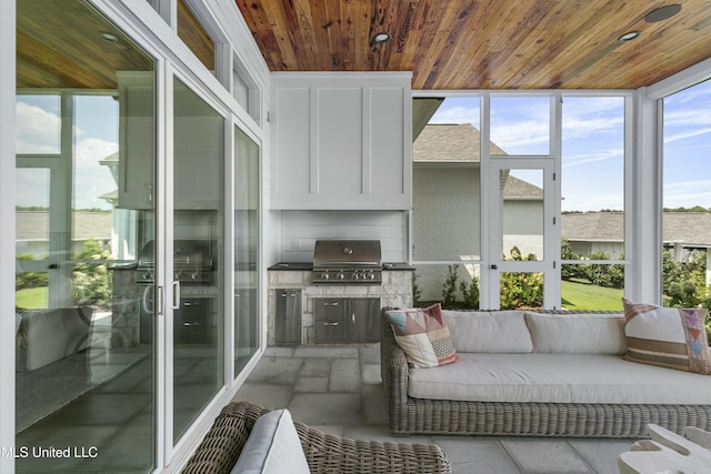 sunroom with wooden ceiling and plenty of natural light