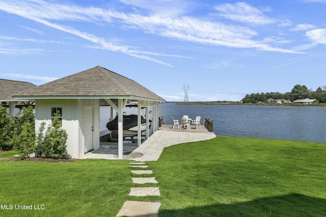 dock area with a patio area, a water view, and a lawn