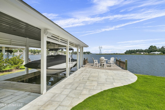 dock area with a water view and boat lift