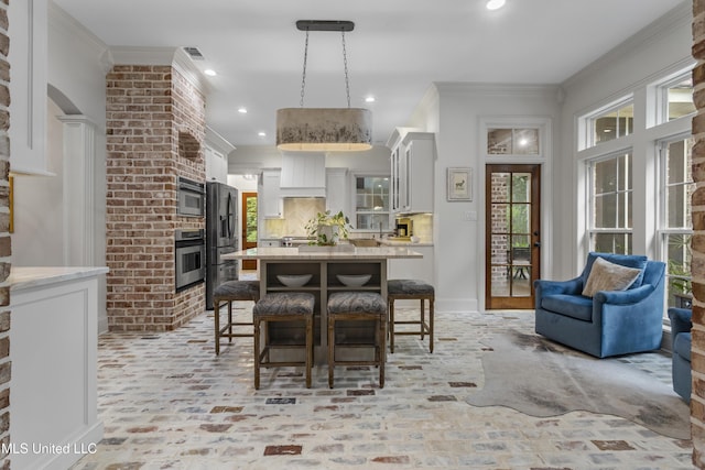 6416 Oliwa Pl, Diamondhead, MS 39525 - dining room with crown molding, brick flooring, and recessed lighting