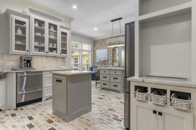 6416 Oliwa Pl, Diamondhead, MS 39525 - kitchen with light countertops, decorative backsplash, stainless steel dishwasher, recessed lighting, and glass insert cabinets
