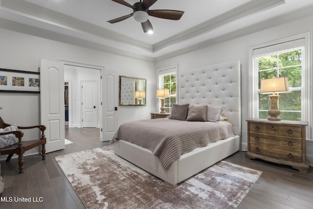 6416 Oliwa Pl, Diamondhead, MS 39525 - bedroom with crown molding, wood-type flooring, a tray ceiling, and a ceiling fan