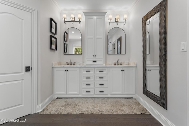 6416 Oliwa Pl, Diamondhead, MS 39525 - full bathroom featuring double vanity, ornamental molding, wood finished floors, and a chandelier