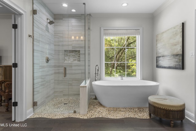 6416 Oliwa Pl, Diamondhead, MS 39525 - full bathroom featuring a soaking tub, a shower stall, wood finished floors, crown molding, and recessed lighting