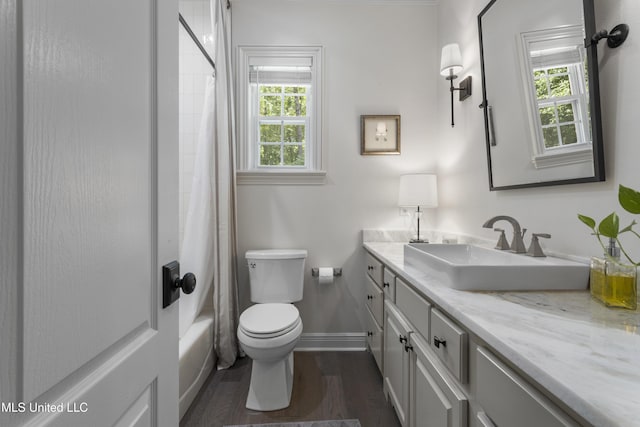 6416 Oliwa Pl, Diamondhead, MS 39525 - bathroom featuring vanity, wood finished floors, and shower / bath combination with curtain
