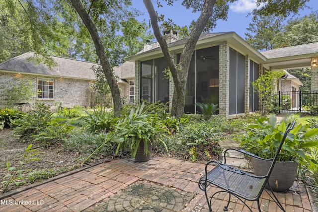 6416 Oliwa Pl, Diamondhead, MS 39525 - view of patio / terrace featuring a sunroom