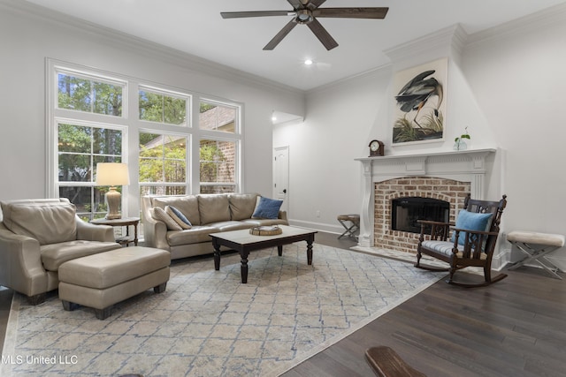 6416 Oliwa Pl, Diamondhead, MS 39525 - living room with a ceiling fan, wood finished floors, a fireplace, ornamental molding, and recessed lighting