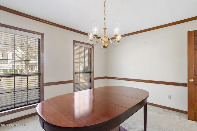 unfurnished dining area featuring ornamental molding, light colored carpet, and plenty of natural light