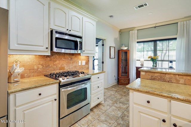 159 Stillhouse Creek Dr, Madison, MS 39110 - kitchen featuring stainless steel appliances, tasteful backsplash, light tile patterned floors, light stone countertops, and baseboards