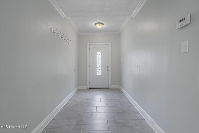 doorway with light tile patterned floors, a textured ceiling, and ornamental molding