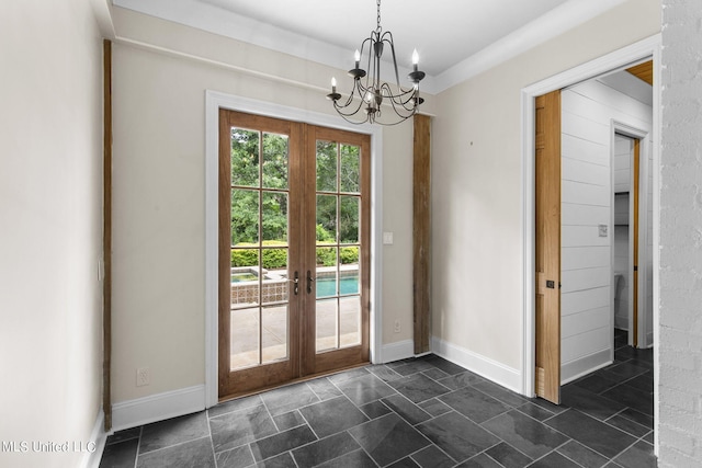 doorway to outside with french doors and a chandelier