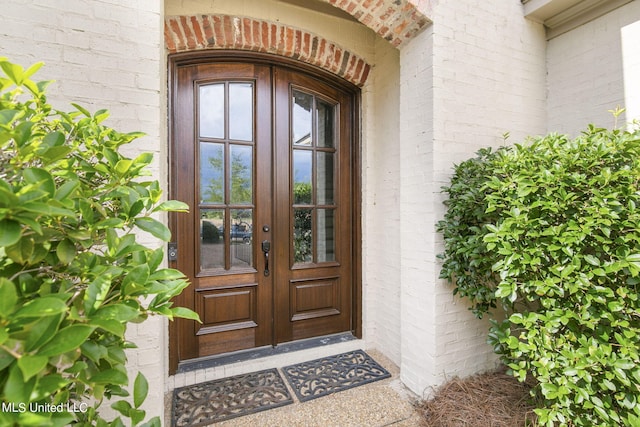 view of exterior entry featuring french doors