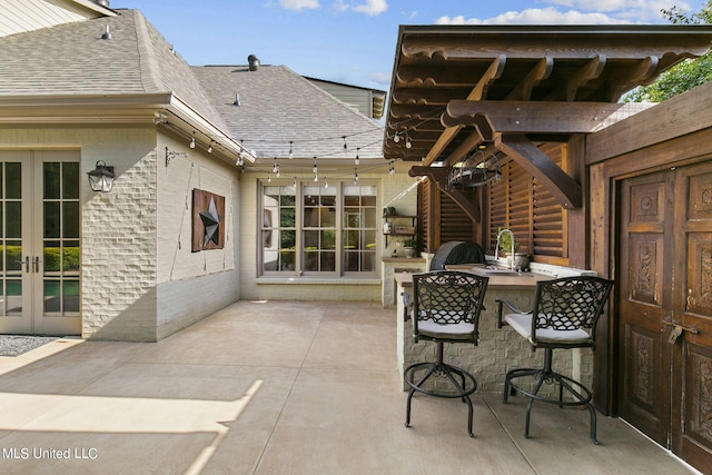 view of patio with sink and french doors