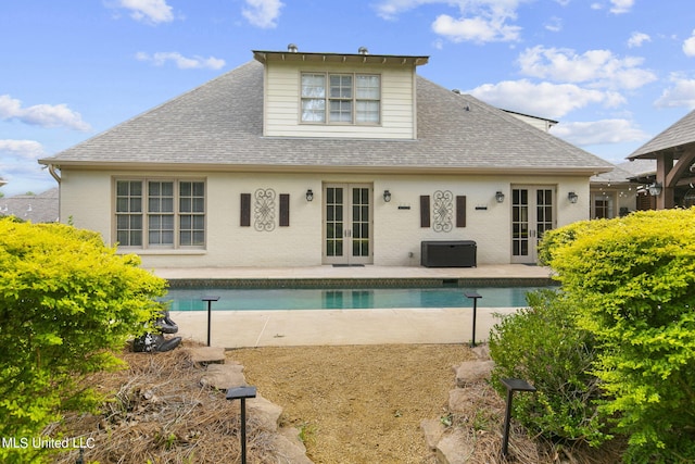 rear view of house with a patio and french doors