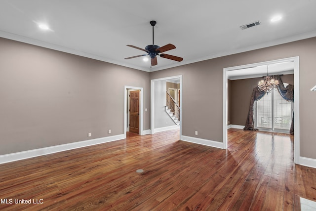 unfurnished room with dark wood-type flooring, crown molding, and ceiling fan with notable chandelier