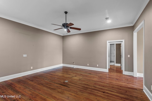 empty room with ornamental molding, ceiling fan, and dark hardwood / wood-style flooring