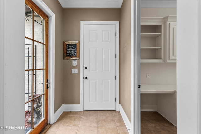 doorway with light tile patterned flooring