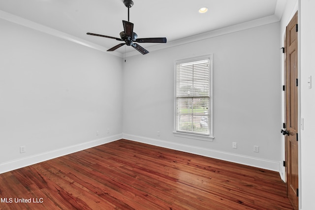 empty room with ornamental molding, hardwood / wood-style flooring, and ceiling fan