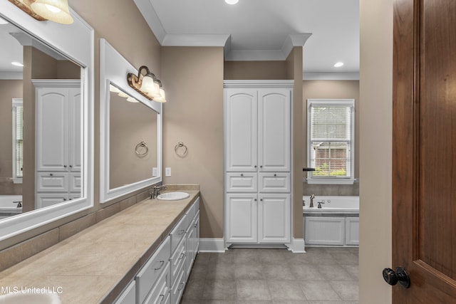 bathroom featuring vanity, crown molding, and a washtub