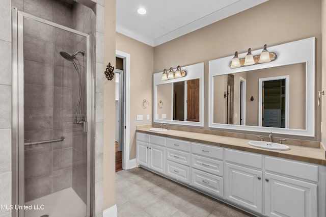 bathroom featuring vanity and a shower with door