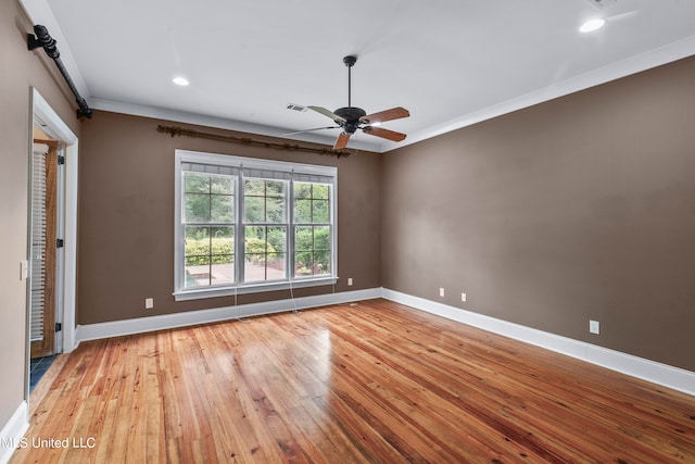 interior space with crown molding, light wood-type flooring, and ceiling fan