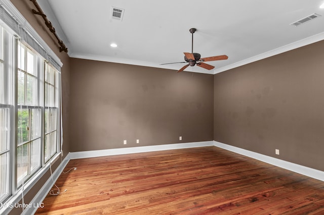 spare room with ceiling fan, crown molding, and hardwood / wood-style floors