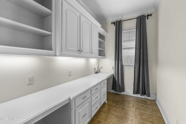 interior space with dark tile patterned floors