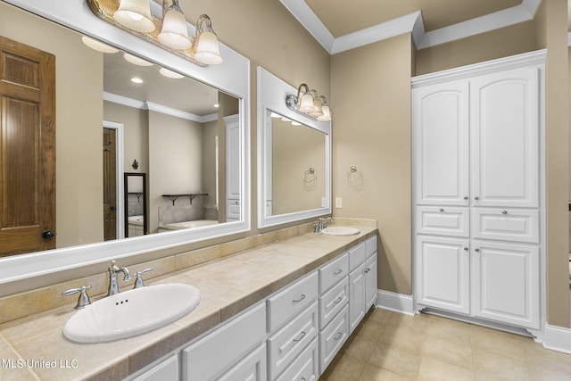 bathroom featuring vanity and ornamental molding