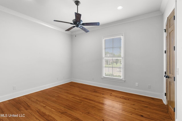 spare room with ceiling fan, hardwood / wood-style flooring, and ornamental molding