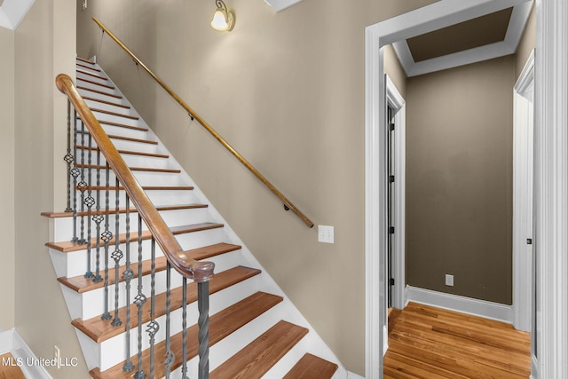 staircase featuring hardwood / wood-style floors