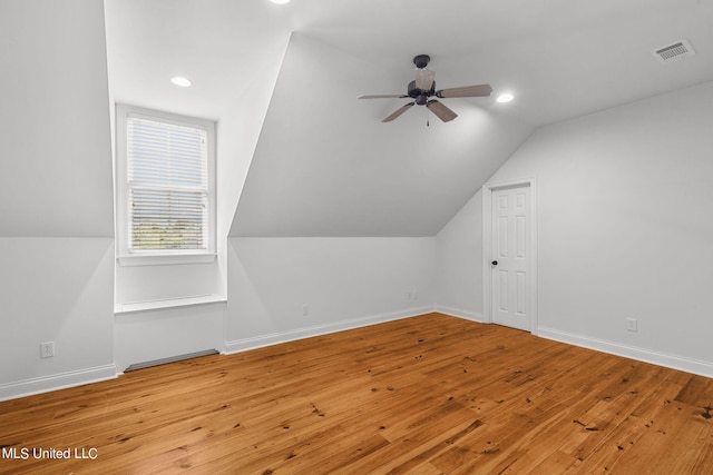 bonus room featuring vaulted ceiling, wood-type flooring, and ceiling fan