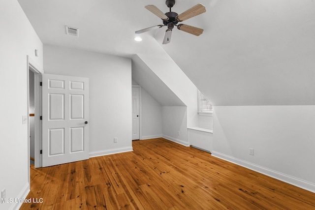 bonus room featuring lofted ceiling, wood-type flooring, and ceiling fan