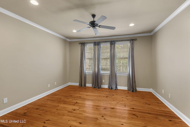 unfurnished room featuring ceiling fan, hardwood / wood-style flooring, and ornamental molding