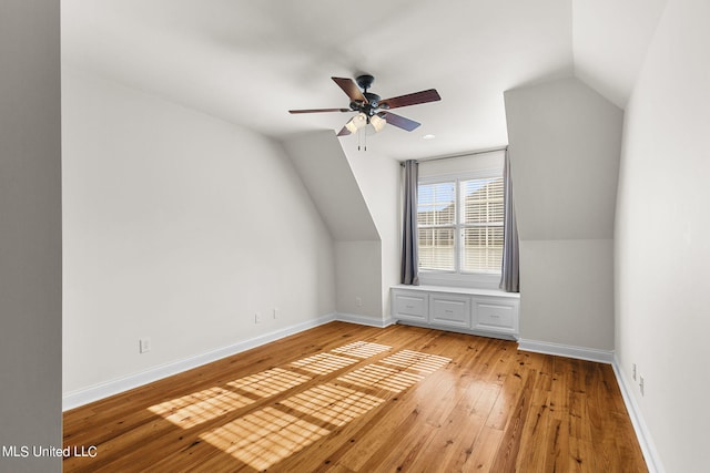 bonus room featuring lofted ceiling, light wood-type flooring, and ceiling fan