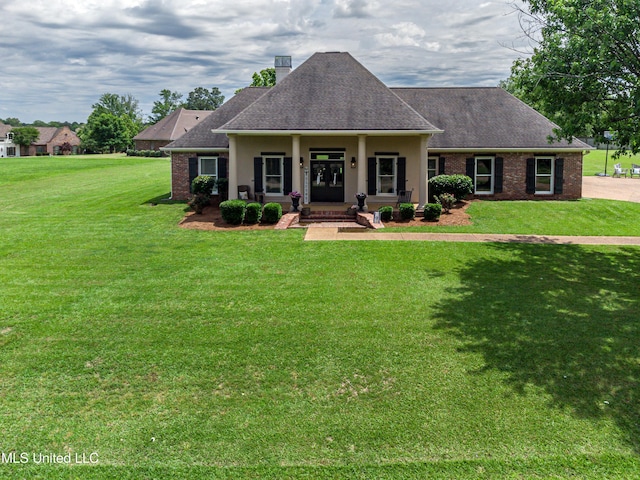 126 Beaufort Cir, Madison, MS 39110 - craftsman-style house with covered porch, a chimney, brick siding, and a front yard